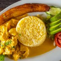 Guatita · Arroz amarillo, maduro, ensalada, y aguacate. / Tripe stew, yellow rice, fried sweet plantai...