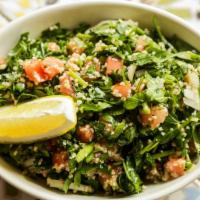 Tabouleh · Cracked wheat with chopped parsley, tomatoes, scallions, onions, and lemon juice.