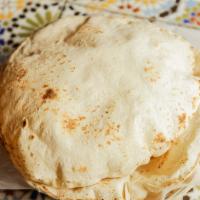 Pita Bread · Freshly baked and hot from the oven.