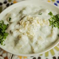 Cucumber Yogurt · Cucumbers in low-fat yogurt, garlic and feta cheese. Served with one pita.