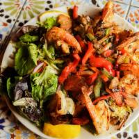 Shrimp Kabob Platter · Grilled shrimp served over couscous with sauteed vegetables.