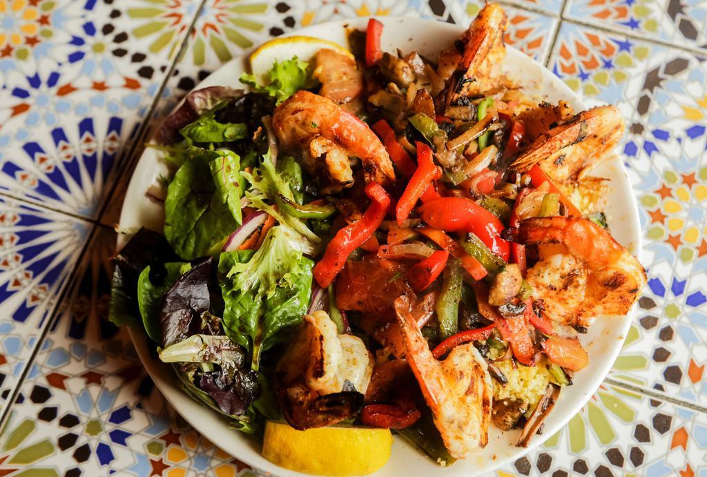 Shrimp Kabob Platter · Grilled shrimp served over couscous with sauteed vegetables.