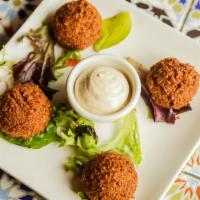 Falafel Platter · Chickpea croquettes mixed with onions, garlic, parsley, and seasonings. Served with green sa...