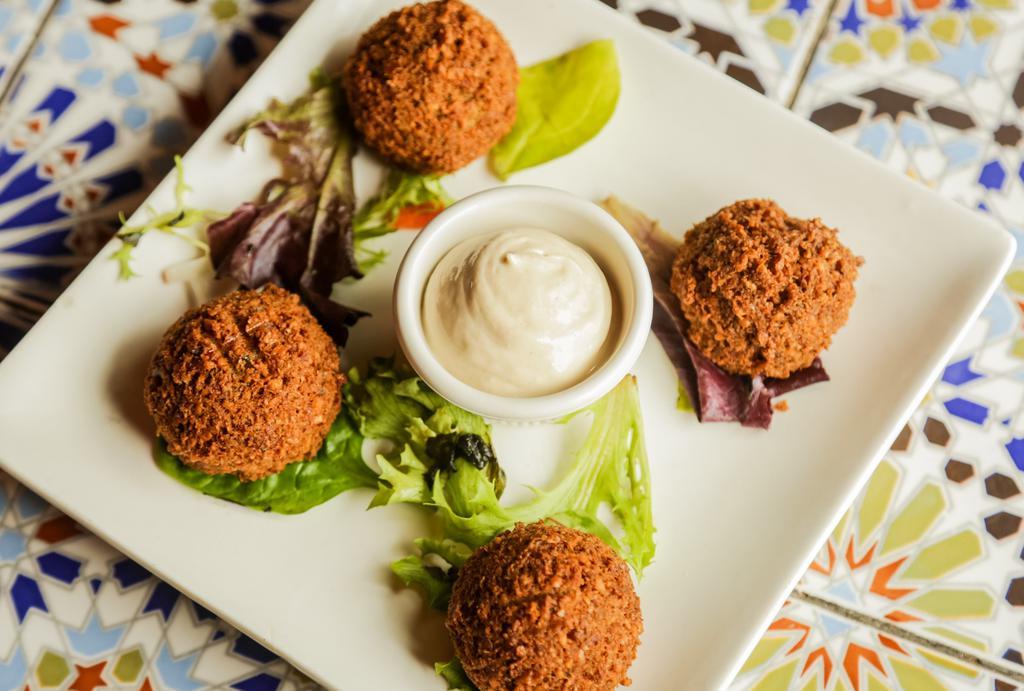 Falafel Platter · Chickpea croquettes mixed with onions, garlic, parsley, and seasonings. Served with green salad and pita bread with your choice of hummus or babghanouj.