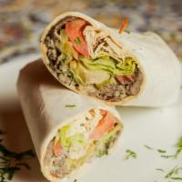 Shawarma Sandwich · Slices of marinated beef and lamb from the rotisserie. Served with lettuce, tomato, onion, a...