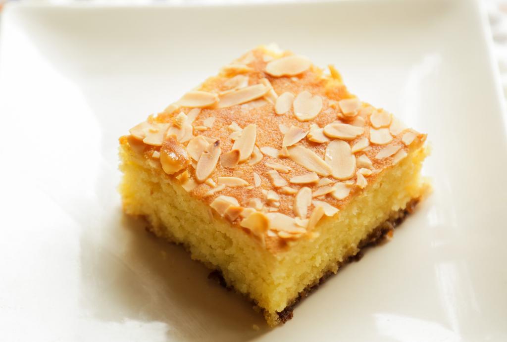 Basbousa · Semolina cake made with yogurt and honey with almonds.