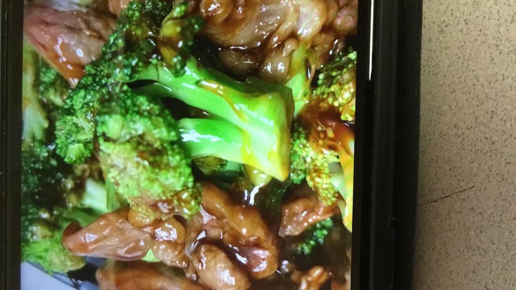 Beef With Broccoli · Served with chicken, pork fried rice or plain fried and an egg roll.