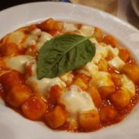 Gnocchi Sorrentina · Potato dough gnocchi with fresh tomato sauce mozzarella and basil.