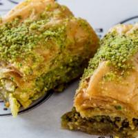 Turkish Baklava · Layers of filo filled with chopped nuts and bathed in mildly sweet honey finished w/ crumble...