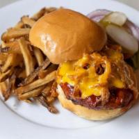 Texas Turkey Burger · Ground Turkey Patty with Cheddar, Fried Onions Ribbons & BBQ Sauce, Side of Fries or Salad