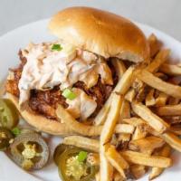 Bbq Pork Sandwich · Slow Roasted Pulled Pork Topped with BBQ Sauce, Chipotle Slaw & Jalapenos, Side of Fries or ...