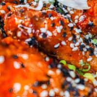 Sweet Thai Chili Wings · Sesame seeds and scallions.