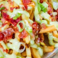 Loaded Fries · Cheddar, scallions, bacon bits, ranch dressing.