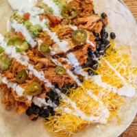 The Mission · Tinga, red rice, black beans, jack and cheddar cheese, jalapeños, sour cream and guacamole