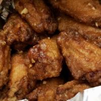 Garlic & Soy Sauce Wings · 6 fried chicken wings covered with Korean style garlic & soy sauce.