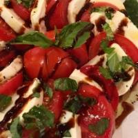 Caprese Salad · Romain lettuce, tomato, roasted red pepper, lite garlic, basil