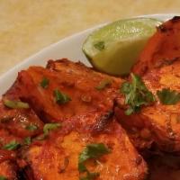 Paneer Tikka · Marinated fresh cottage cheese baked i clay oven & served with tamarind & coriander sauces