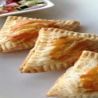 Kurry Puff (3) · Crispy pastry dough stuffed with chicken, onions, potatoes, and curry powder served with cuc...