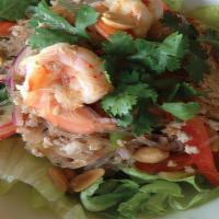 Yum Woon Sen (Spicy) · Glass noodle mixed with lime dressing, shrimps, ground chicken, tomato, onion, scallion, and...