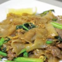 Pad See Ew · Sautéed wide rice noodles with choice of meat, Chinese broccoli, egg, and a seasoned sauce.