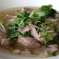 Noodle Soup · A big bowl of sliced beef with meatballs in beef broth soup with rice noodle served with bea...