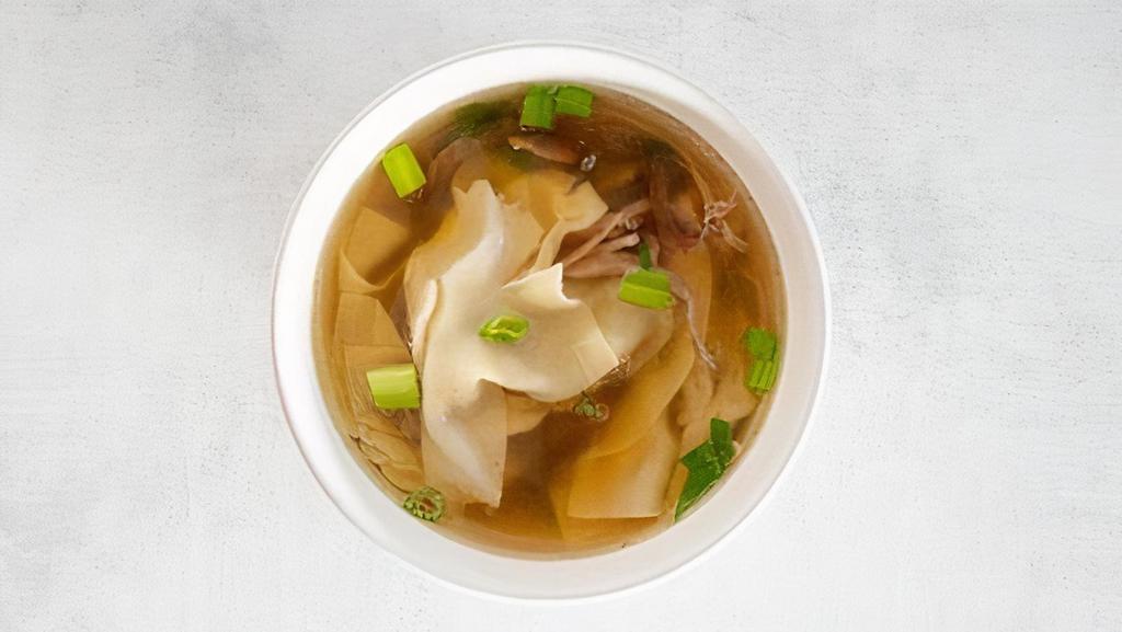 Wonton Soup · Handmade ground pork wontons in a clear chicken broth based soup.  Garnished with scallions and shredded roast pork.