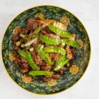 Beef With Snow Peas (Small) · Sliced beef with snow peas and napa cabbage wok tossed in our classic brown sauce.