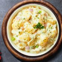 Mashed Potato · Mashed Idaho potatoes cooked, seasoned with garlic, butter, and topped with crispy bits of b...