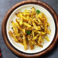 Garlic Parmesan Fries · (Vegetarian) Idaho potato fries cooked until golden brown and garnished with garlic, salt, a...