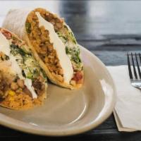 Chili Beef Burrito · Beef chili, Mexican rice, pinto beans, pico de gallo, Monterey Jack cheese sour cream on a s...