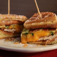 Night Shifter · Waffle sandwich: Buttermilk battered fried chicken, egg, cheddar cheese, spinach, bacon with...
