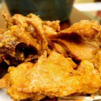 Kicking Fried Chicken · Thai seasoned chicken thigh deep fried until crispy. Served with sweet and sour sauce.