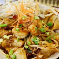 Pad Thai Noodles · Sweet tamarind sauce stir fried with rice noodles and egg. Served with bean sprouts and carr...