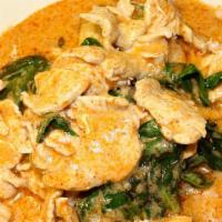 Evil Jungle Curry · Red curry paste, bamboo shoots, coconut milk, basil over sliced cabbage.