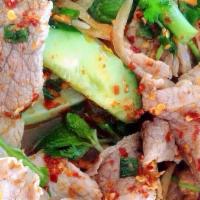 Beef Salad · Thinly sliced beef, green-leaf lettuce, tomatoes, fresh lime juice, onions, cilantro, mint, ...