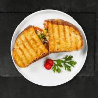 Clucking Parmigiana Panini · Breaded chicken, fresh mozzarella, tomato sauce and parmesan cheese.