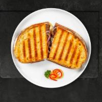 Combo Coupler Panini · Pastrami, corned beef, provolone cheese, lettuce, tomatoes, mustard and Russian dressing.