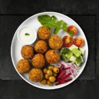 Fall For Falafel · Baked and fried mixture of garbanzo beans, fava beans, coriander, cumin, parsley and onions....