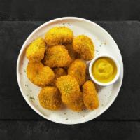 Naughty Nugget · Bite sized nuggets of chicken breaded and fried until golden brown. Served with your choice ...