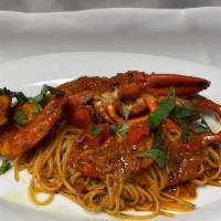 Lobster Fra Diavolo · Whole Lobster butterflied and sauteed in spicy tomato sauce with side of pasta.