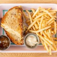 Parisian Grilled Cheese. · Brie & melted leeks on toasted sourdough with a side of fig jam
