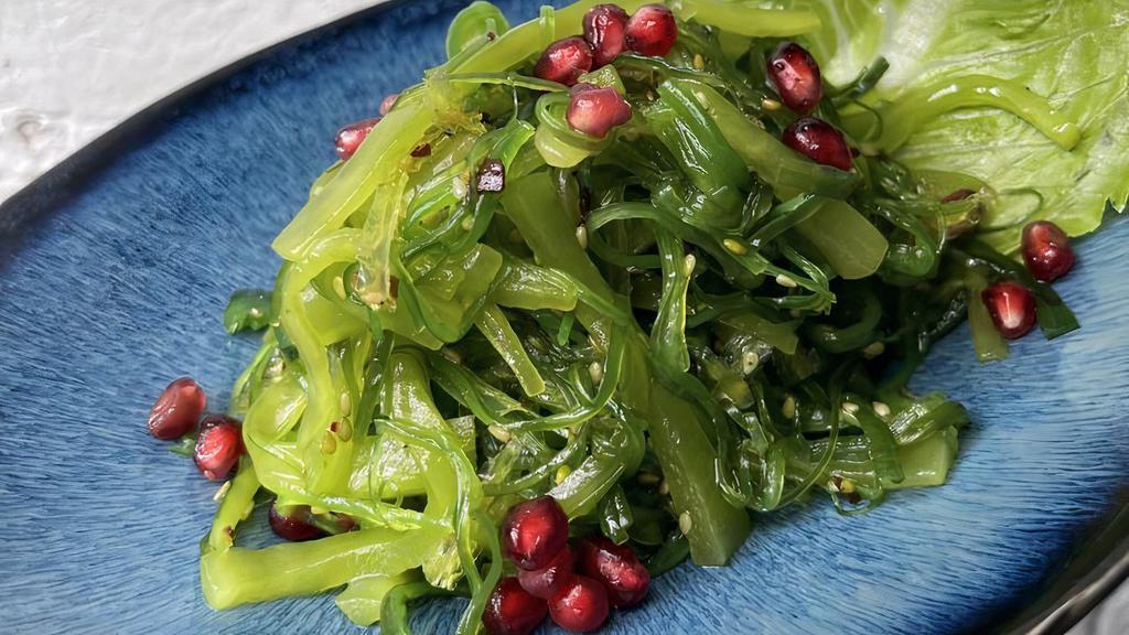 Seaweed Salad · Green seaweed with sesame seed on top.