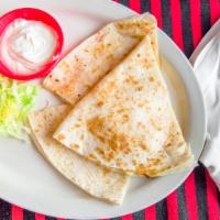 Quesadillas · Flour tortilla stuffed with cheese, mushrooms, served with sour cream and pico de gallo.