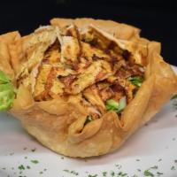 Taco Salad · Fried flour tortilla stuffed with grilled chicken, black beans, lettuce, pico de gallo, avoc...