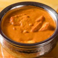 13 Butter Chicken · Tender tandoori chicken simmered with creamy tomato and onion sauce with Indian spices, come...