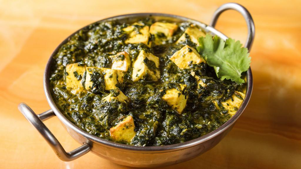 Saag Paneer · Fresh spinach cooked with Indian fried cheese.