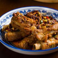 香辣排骨 Spicy Pork Spare Ribs  · Mild. Seasoned pork ribs, dried red chili pepper, & crushed peanuts.