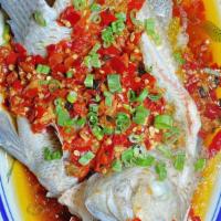 剁辣椒蒸鱼 Xiang River Fish · Pickled chopped chilies, fresh tilapia, steamed to perfection, hunan delicacy; (option for s...