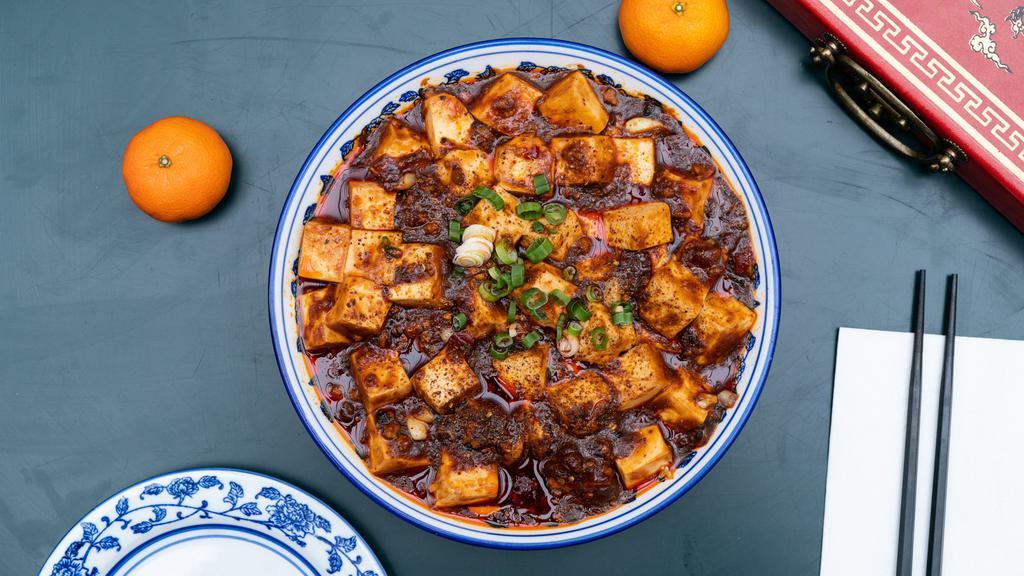 麻婆豆腐 Mapo Tofu · Spicy. Mapo tofu is a popular Chinese dish from Sichuan province. It consists of tofu set in a spicy sauce, typically a thin, oily, and bright red suspension, based on douban and douchi, along with minced meat, traditionally pork. **option for no meat is available as well.