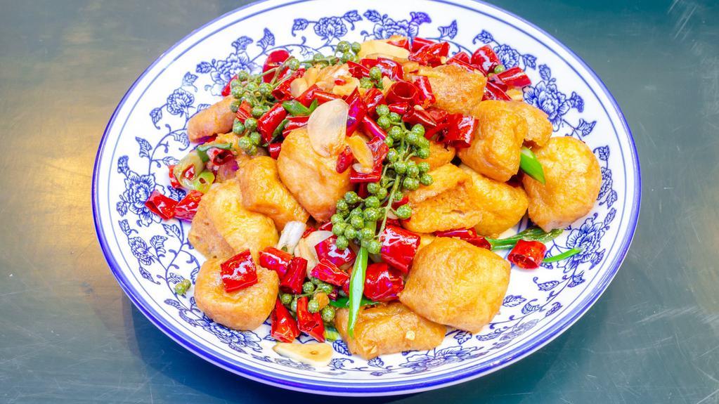 老妈油豆腐 Lao Ma Puffed Tofu · Mild. Stir fried tofu puffs, garlic, fresh peppercorn.